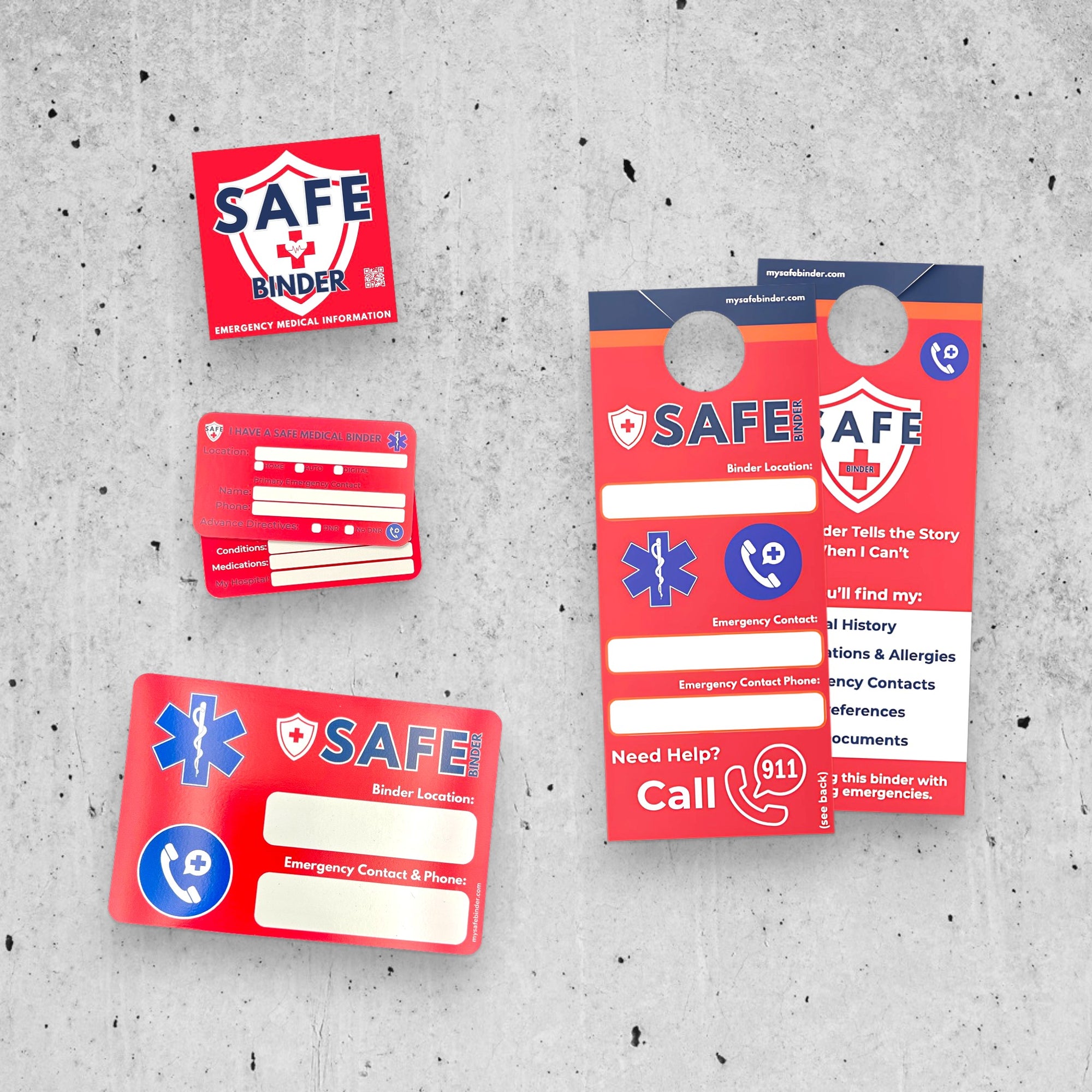 Set of SAFE Binder emergency information tools on a gray concrete surface