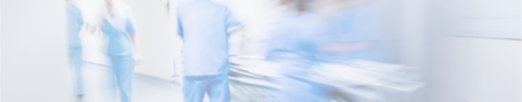 Doctors rushing a gurney down the hallway
