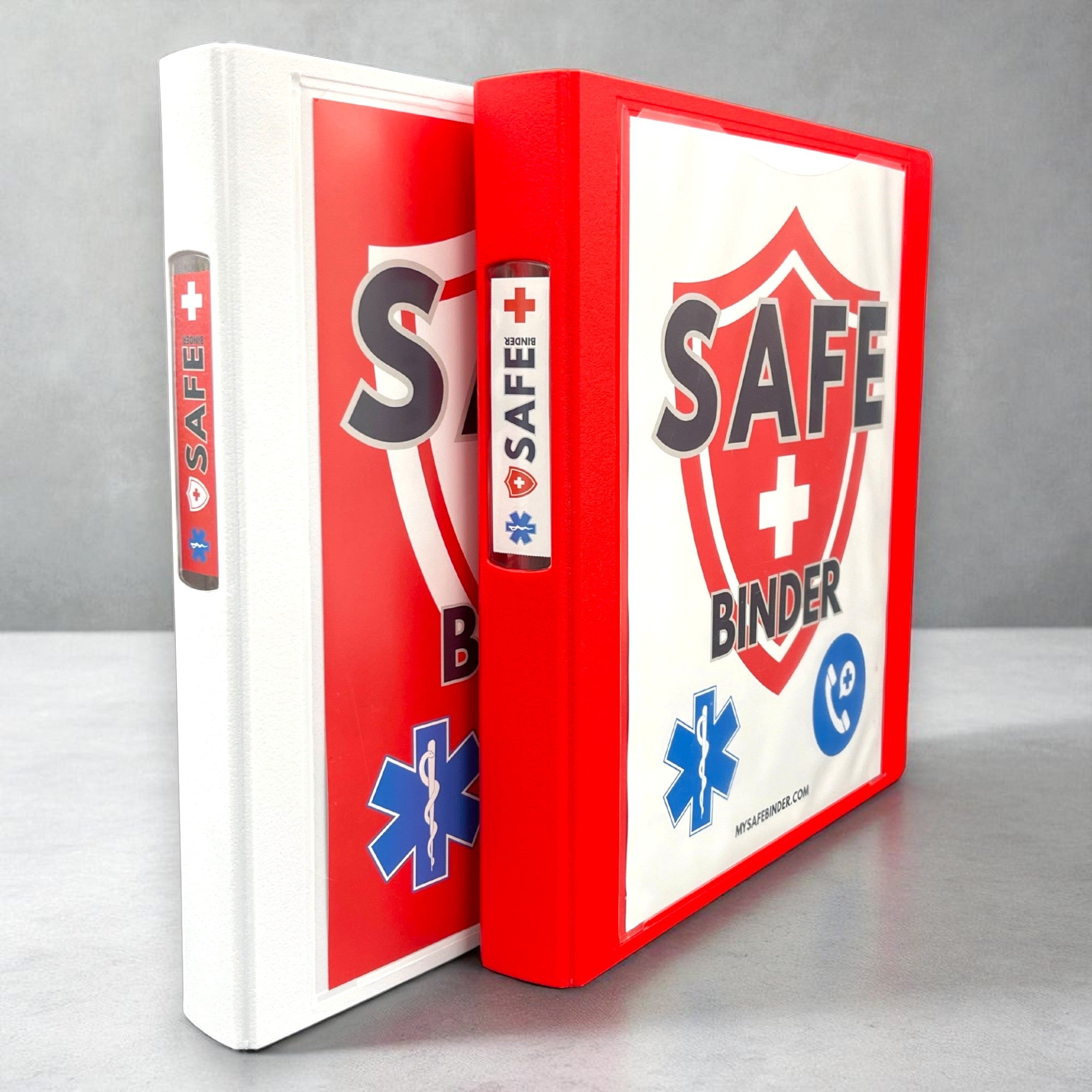 Red and white SAFE Binders on a gray background