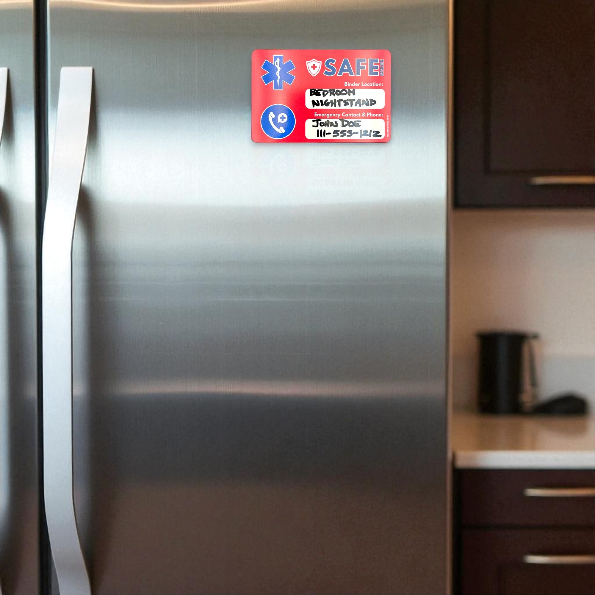 A red SAFE magnet with contact information on a stainless steel fridge