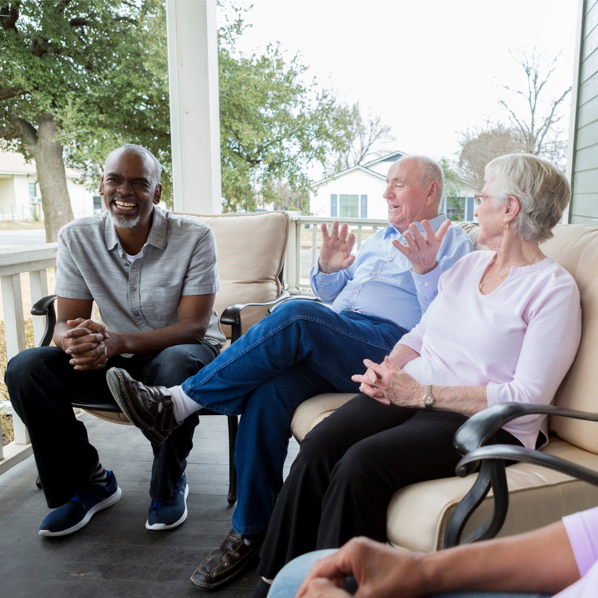 Neighbors sitting on the porch talking
