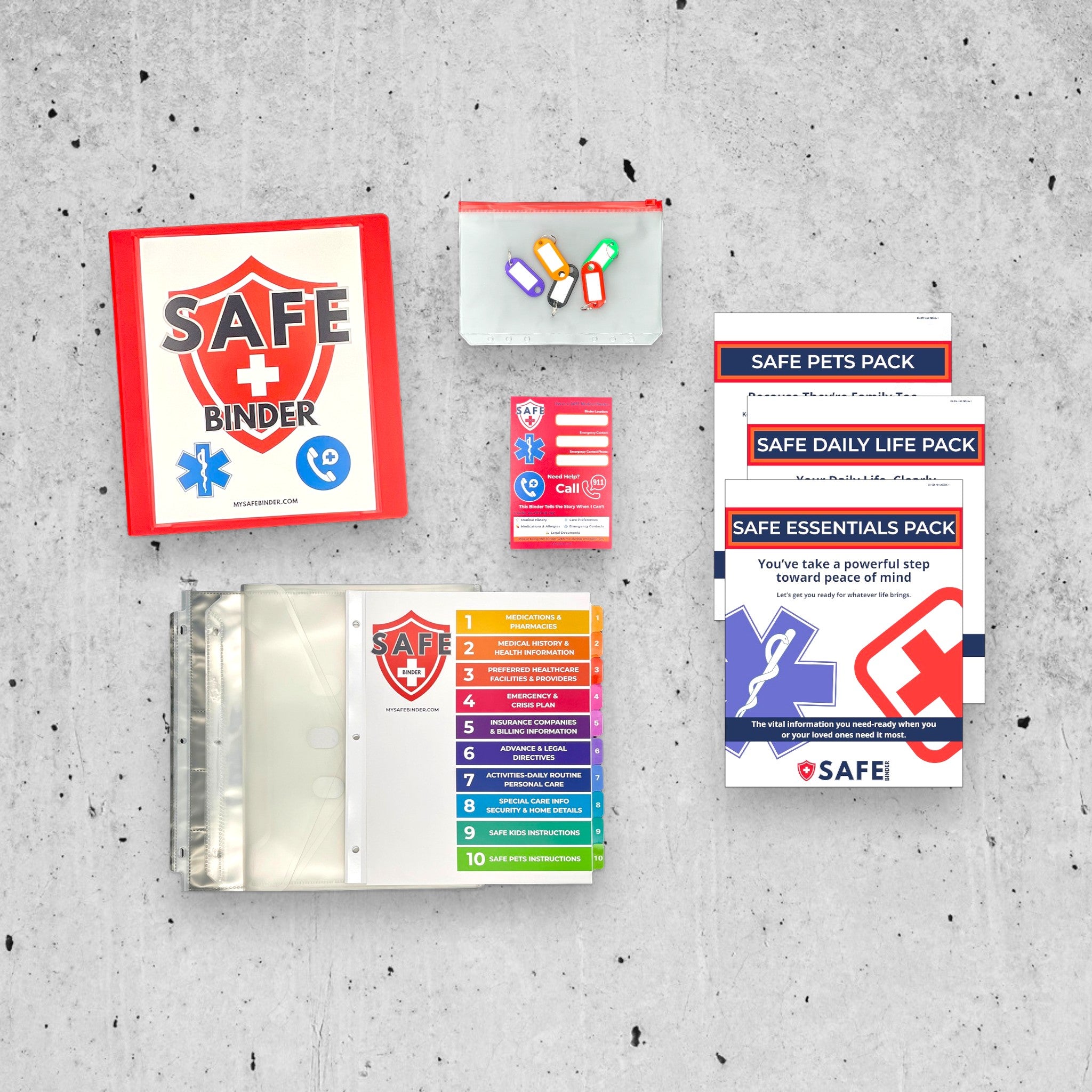 White SAFE Binder with SAFE Pets Pack and included materials on a concrete background