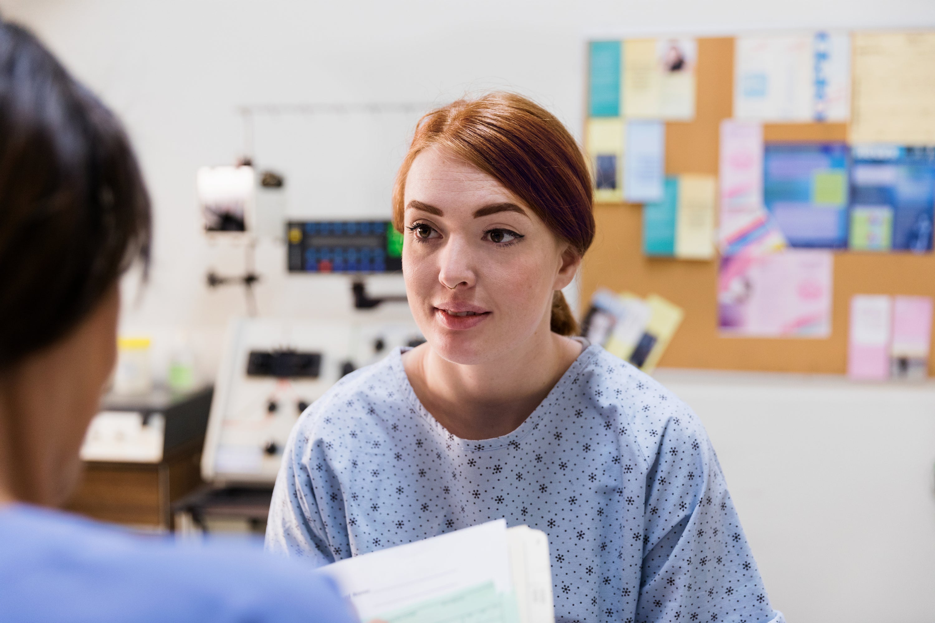 A patient sitting with her doctor