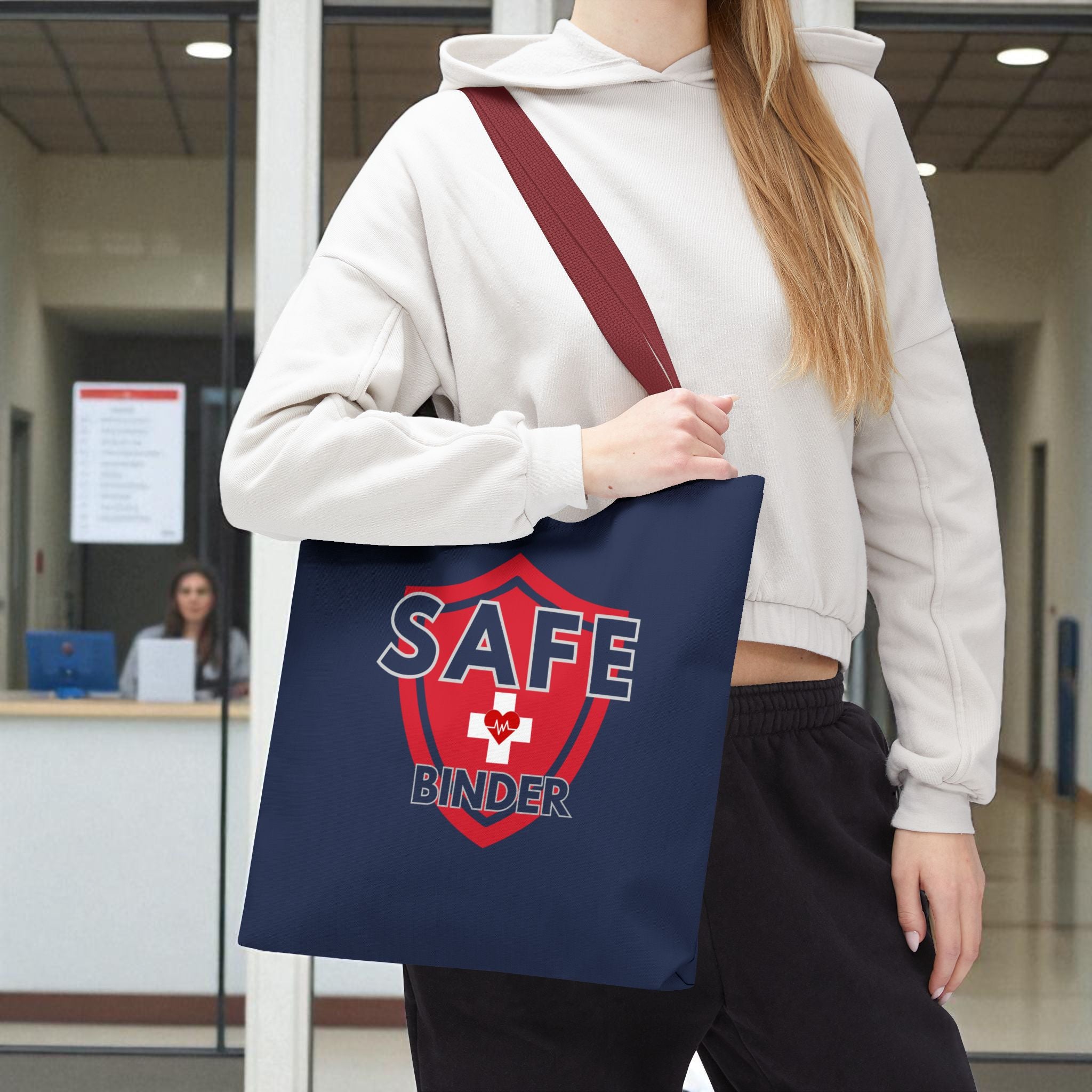 A blue tote bag resting on a woman's hip