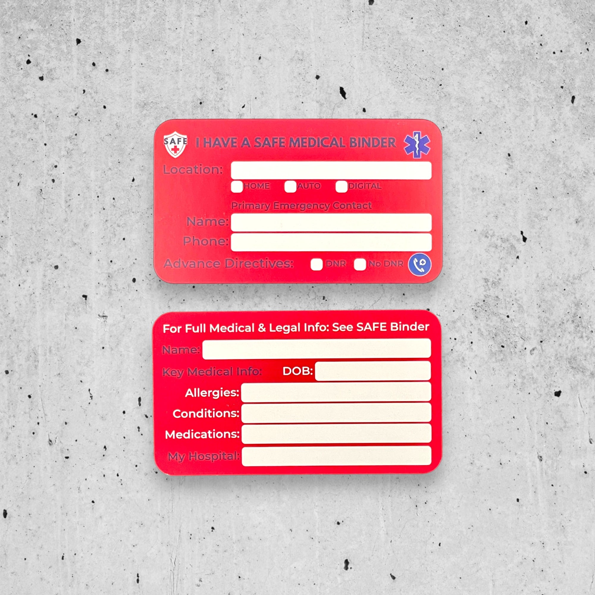 Two red medical information cards on a textured gray concrete background