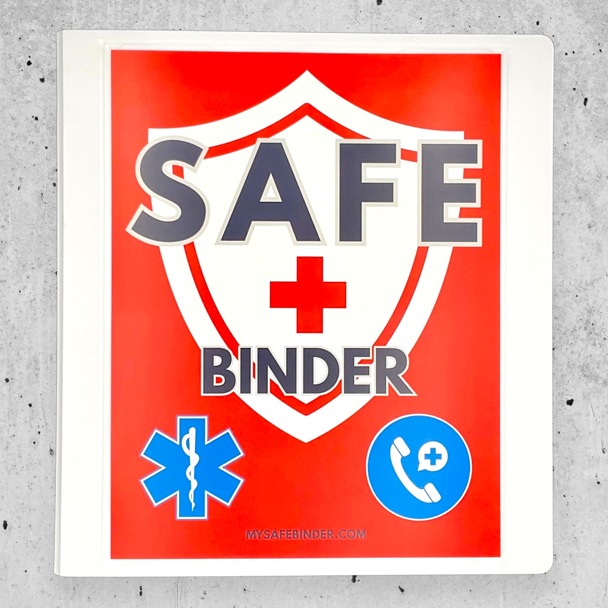 White SAFE Binder with medical symbols on a gray concrete surface
